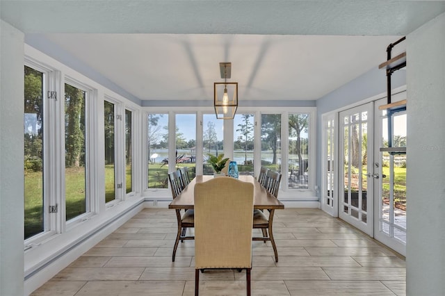 277 Sunrise Pt, Lake Mary, FL 32746 - sunroom / solarium with french doors, plenty of natural light, and a water view