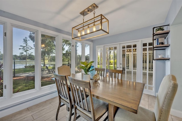 277 Sunrise Pt, Lake Mary, FL 32746 - sunroom / solarium with french doors, a water view, and a chandelier