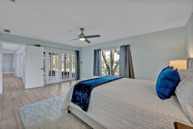 277 Sunrise Pt, Lake Mary, FL 32746 - bedroom featuring access to outside, multiple windows, baseboards, and wood finished floors