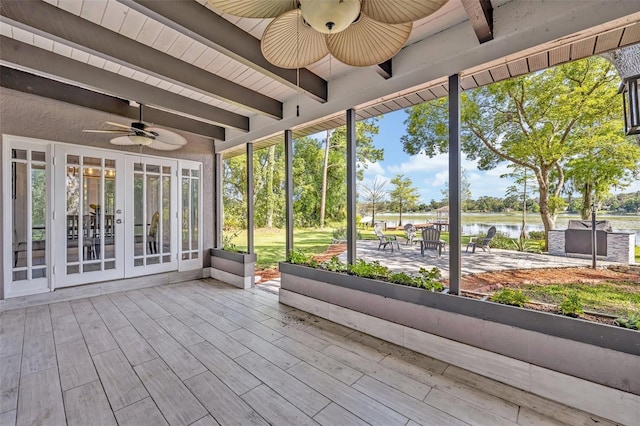 277 Sunrise Pt, Lake Mary, FL 32746 - unfurnished sunroom with ceiling fan, a water view, beam ceiling, french doors, and healthy amount of natural light