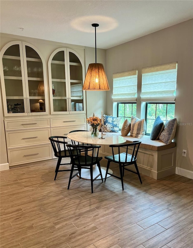 1266 Spotted Sandpiper Loop, Winter Springs, FL 32708 - dining space featuring light wood-style floors, baseboards, and breakfast area