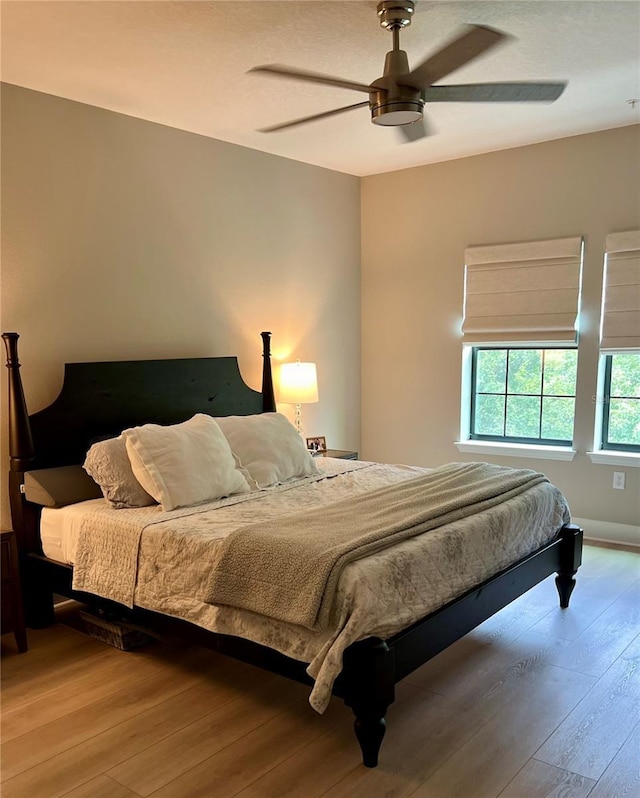 1266 Spotted Sandpiper Loop, Winter Springs, FL 32708 - bedroom with light wood-style floors and ceiling fan