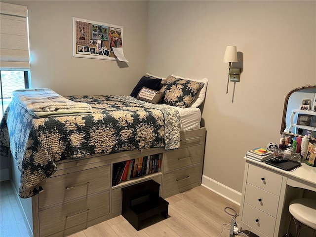 1266 Spotted Sandpiper Loop, Winter Springs, FL 32708 - bedroom featuring light wood finished floors and baseboards