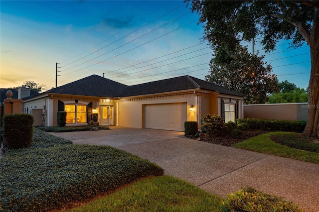 5973 Chesapeake Park Unit 58, Orlando, FL 32819 - single story home featuring stucco siding, a garage, driveway, and roof with shingles