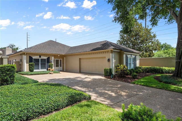 5973 Chesapeake Park Unit 58, Orlando, FL 32819 - ranch-style home featuring stucco siding, a garage, and concrete driveway