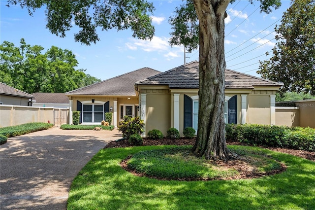 5973 Chesapeake Park Unit 58, Orlando, FL 32819 - view of front of property with stucco siding and driveway