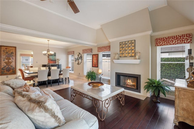 5973 Chesapeake Park Unit 58, Orlando, FL 32819 - living room featuring a glass covered fireplace, dark wood-style floors, a chandelier, a ceiling fan, and ornamental molding