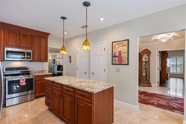 5973 Chesapeake Park Unit 58, Orlando, FL 32819 - kitchen with stainless steel appliances, brown cabinets, light stone countertops, pendant lighting, and a kitchen island
