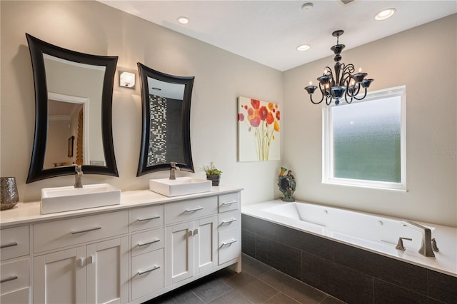 5973 Chesapeake Park Unit 58, Orlando, FL 32819 - full bath featuring double vanity, a garden tub, a chandelier, recessed lighting, and tile patterned floors