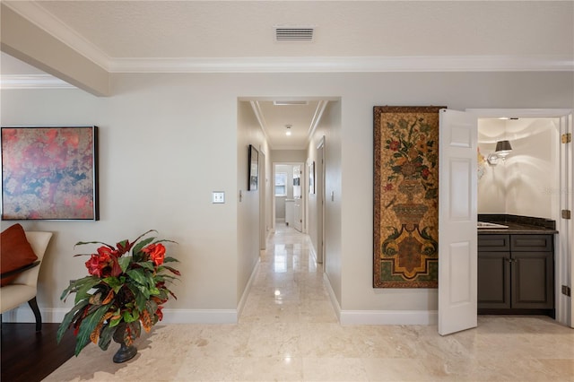 5973 Chesapeake Park Unit 58, Orlando, FL 32819 - corridor with ornamental molding and light marble finish flooring