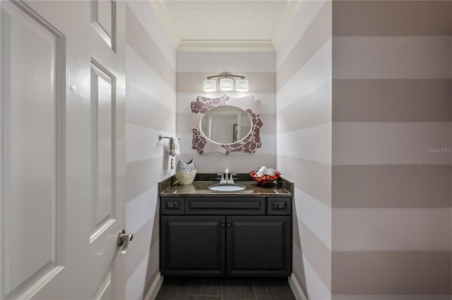 5973 Chesapeake Park Unit 58, Orlando, FL 32819 - bathroom featuring vanity, crown molding, and a textured ceiling
