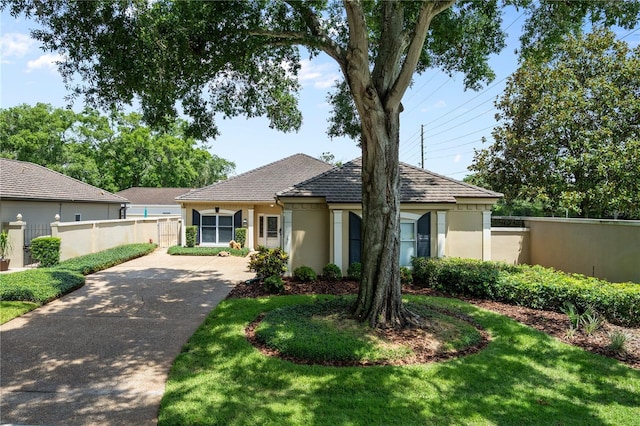 5973 Chesapeake Park Unit 58, Orlando, FL 32819 - single story home with driveway and stucco siding