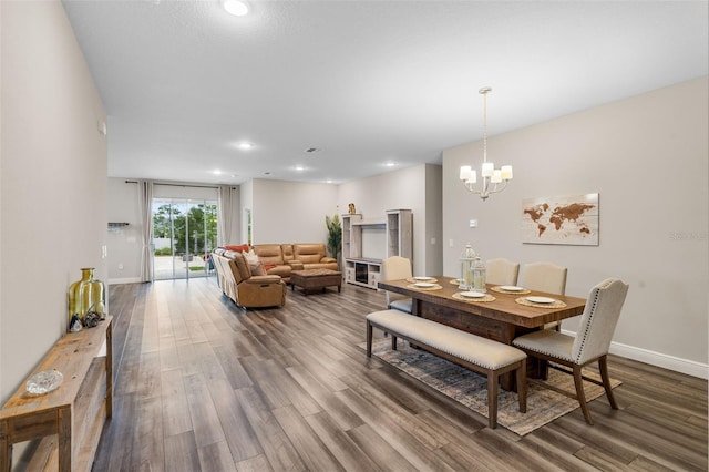 4811 SW 108th Place Rd, Ocala, FL 34476 - dining space with dark wood-style floors, a chandelier, baseboards, and recessed lighting
