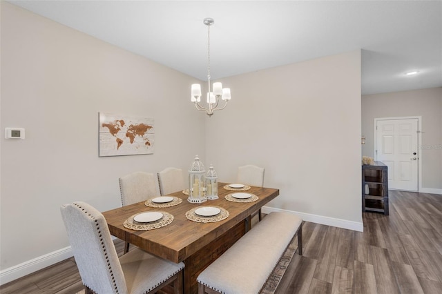 4811 SW 108th Place Rd, Ocala, FL 34476 - dining area with baseboards, wood finished floors, and a chandelier