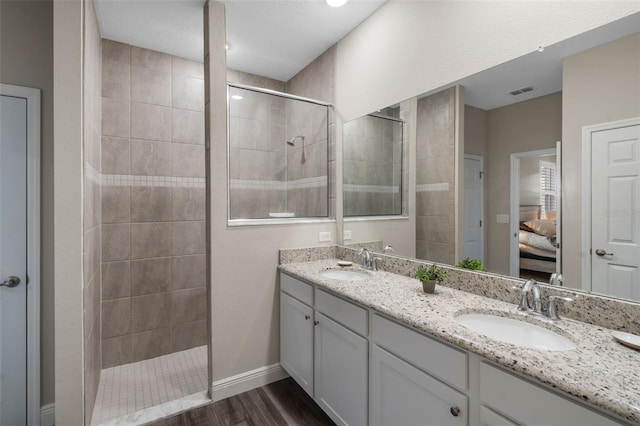 4811 SW 108th Place Rd, Ocala, FL 34476 - ensuite bathroom with walk in shower, wood finished floors, double vanity, and baseboards