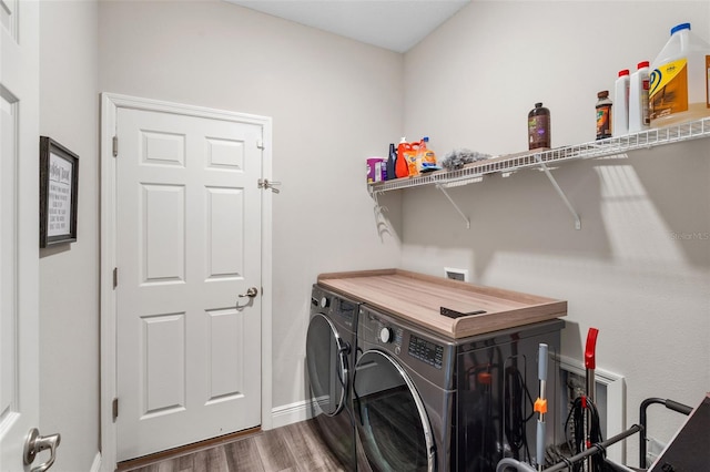 4811 SW 108th Place Rd, Ocala, FL 34476 - clothes washing area featuring washing machine and clothes dryer, wood finished floors, and baseboards