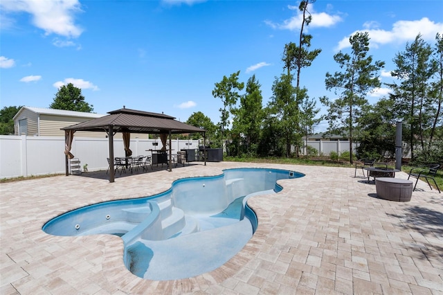 4811 SW 108th Place Rd, Ocala, FL 34476 - view of swimming pool with a gazebo, a patio area, and a fenced backyard