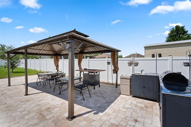4811 SW 108th Place Rd, Ocala, FL 34476 - view of patio / terrace with a gazebo, fence, and outdoor dining area