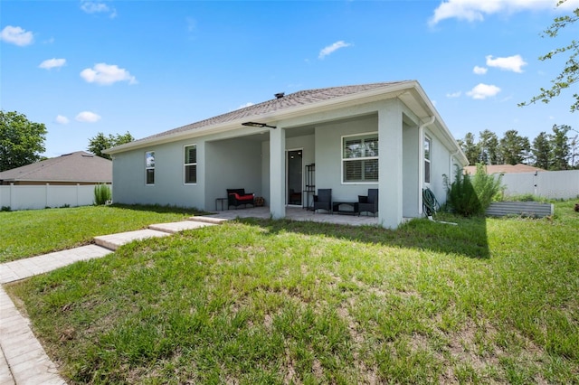 4811 SW 108th Place Rd, Ocala, FL 34476 - back of house with stucco siding and a patio area