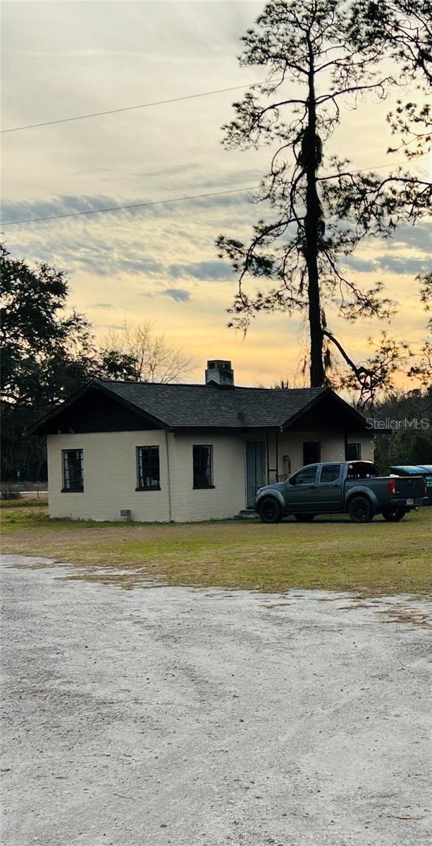 7904AND8010 SE US Highway 301, Hawthorne, FL 32640 - view of front of home featuring a chimney