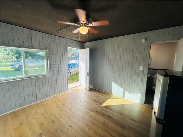 7904AND8010 SE US Highway 301, Hawthorne, FL 32640 - unfurnished room with hardwood / wood-style floors, ceiling fan, and wood walls