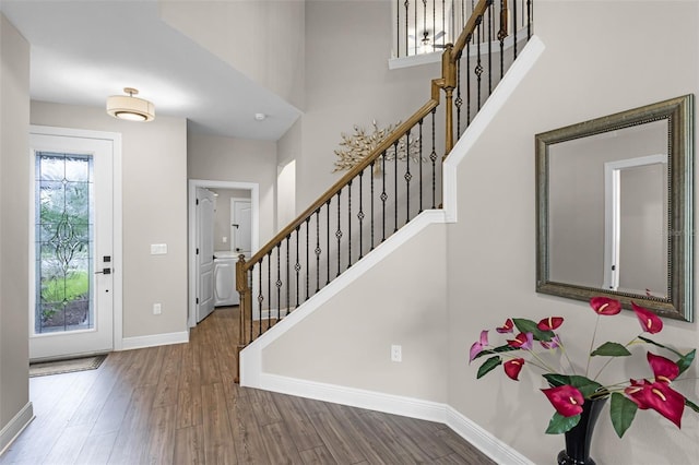 7745 Somersworth Dr, Kissimmee, FL 34747 - foyer with wood finished floors, stairway, and baseboards