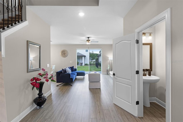 7745 Somersworth Dr, Kissimmee, FL 34747 - hallway featuring wood finished floors and baseboards