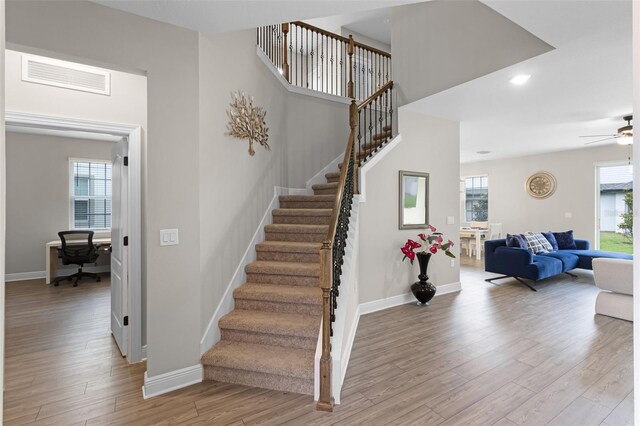 7745 Somersworth Dr, Kissimmee, FL 34747 - stairs with wood finished floors, baseboards, a ceiling fan, and recessed lighting