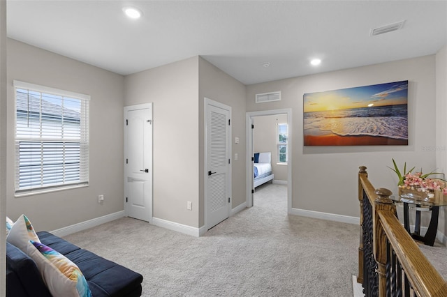 7745 Somersworth Dr, Kissimmee, FL 34747 - interior space with carpet, baseboards, recessed lighting, and an upstairs landing
