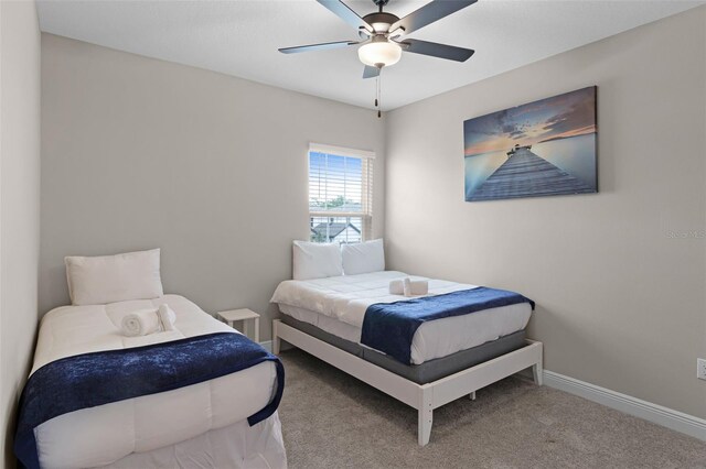 7745 Somersworth Dr, Kissimmee, FL 34747 - bedroom with carpet floors, baseboards, and ceiling fan