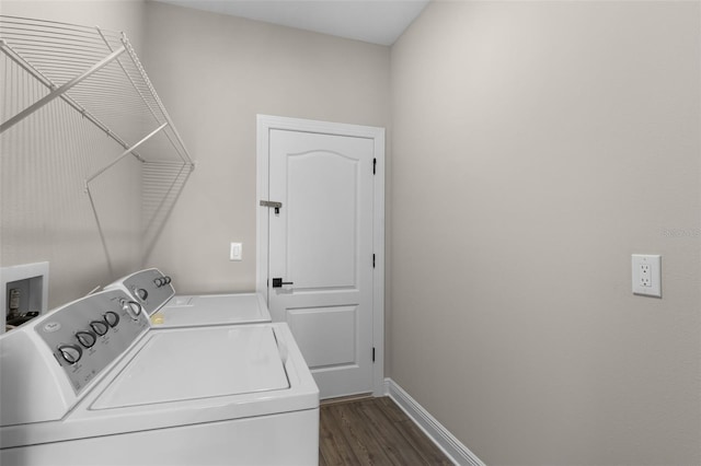 7745 Somersworth Dr, Kissimmee, FL 34747 - laundry room with washing machine and dryer, dark wood-type flooring, and baseboards