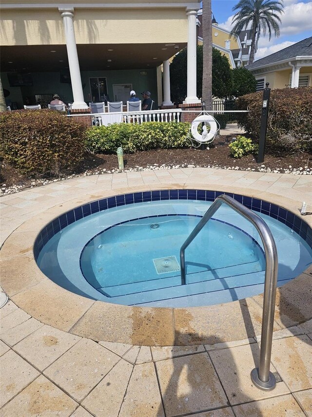 7745 Somersworth Dr, Kissimmee, FL 34747 - view of pool with a hot tub