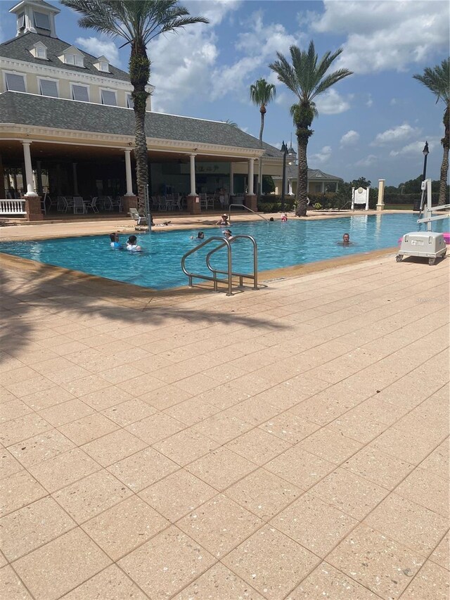 7745 Somersworth Dr, Kissimmee, FL 34747 - community pool featuring a patio area
