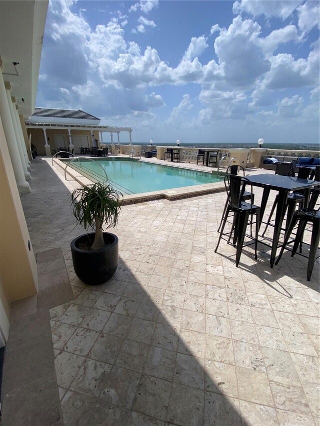 7745 Somersworth Dr, Kissimmee, FL 34747 - community pool featuring a patio