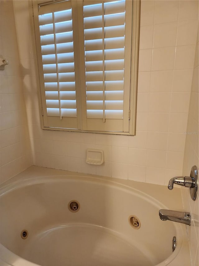 3500 Calabria Ave, Davenport, FL 33897 - full bath featuring healthy amount of natural light and a whirlpool tub