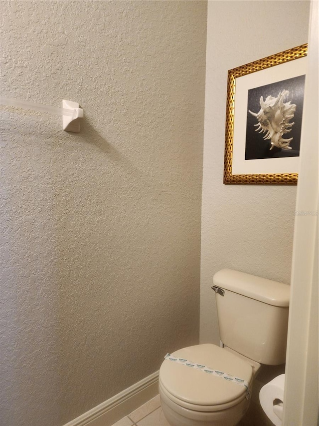 3500 Calabria Ave, Davenport, FL 33897 - bathroom with toilet, tile patterned floors, and baseboards