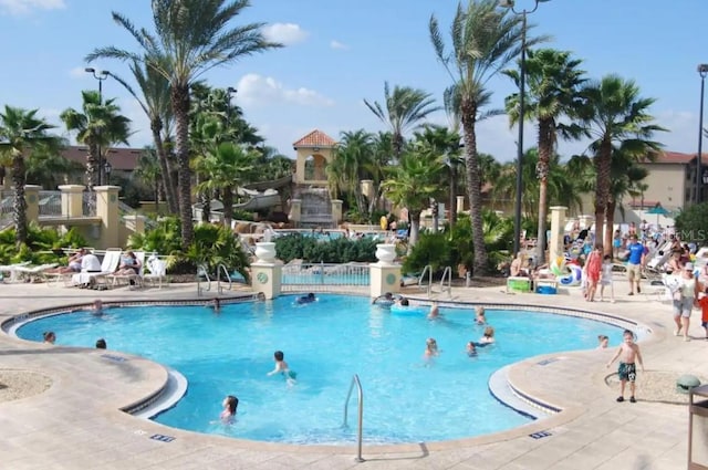 3500 Calabria Ave, Davenport, FL 33897 - community pool featuring a patio