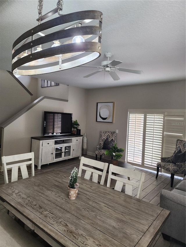 3500 Calabria Ave, Davenport, FL 33897 - dining space featuring a ceiling fan and dark wood-type flooring