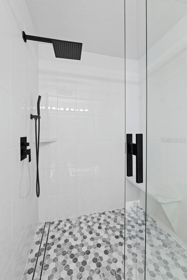 full bathroom with a shower stall