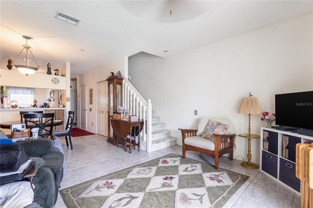 232 Countryside Key Blvd, Oldsmar, FL 34677 - tiled living room featuring stairway