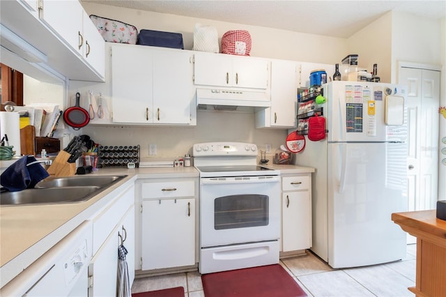 232 Countryside Key Blvd, Oldsmar, FL 34677 - kitchen with white appliances, under cabinet range hood, a sink, and light countertops