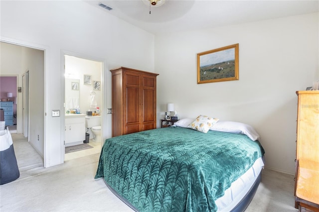 232 Countryside Key Blvd, Oldsmar, FL 34677 - bedroom featuring light colored carpet, ensuite bathroom, and a towering ceiling