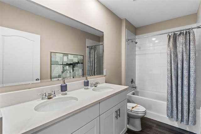 full bathroom with shower / bath combo with shower curtain, toilet, wood finished floors, and double vanity