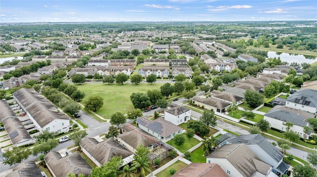 aerial view of residential area with a large body of water