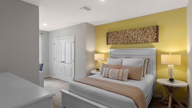 carpeted bedroom featuring baseboards, recessed lighting, and a closet