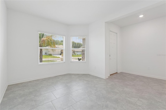 6139 Claystone Way, Mount Dora, FL 32757 - spare room with baseboards, recessed lighting, and light tile patterned floors