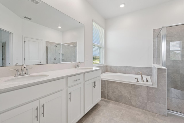 6139 Claystone Way, Mount Dora, FL 32757 - full bath with a stall shower, double vanity, a garden tub, tile patterned flooring, and recessed lighting