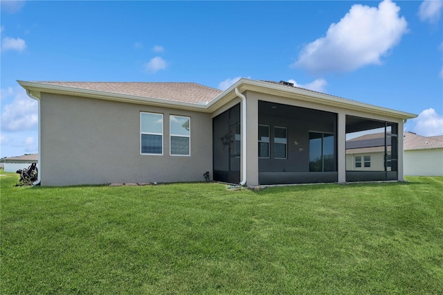6139 Claystone Way, Mount Dora, FL 32757 - back of property with a sunroom, a lawn, and stucco siding
