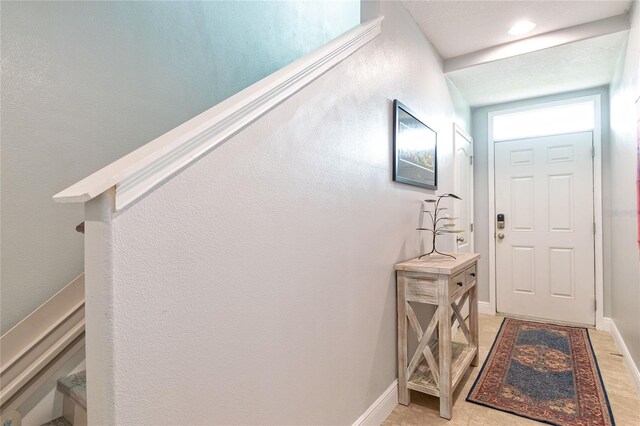 109 Kenny Blvd, Haines City, FL 33844 - entryway featuring stairway and baseboards