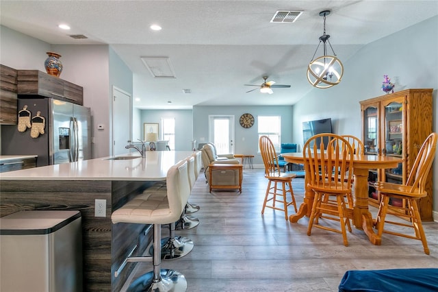 109 Kenny Blvd, Haines City, FL 33844 - dining space featuring vaulted ceiling, a ceiling fan, light wood-type flooring, and recessed lighting